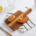 Acacia wood cutting board with ergonomic carry handle, ideal for chopping and food prep from Vertex Kitchenware.