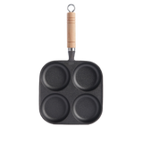 Cast iron 4-well breakfast pan by Vertex Kitchenware with four cooking wells and durable, non-stick surface.