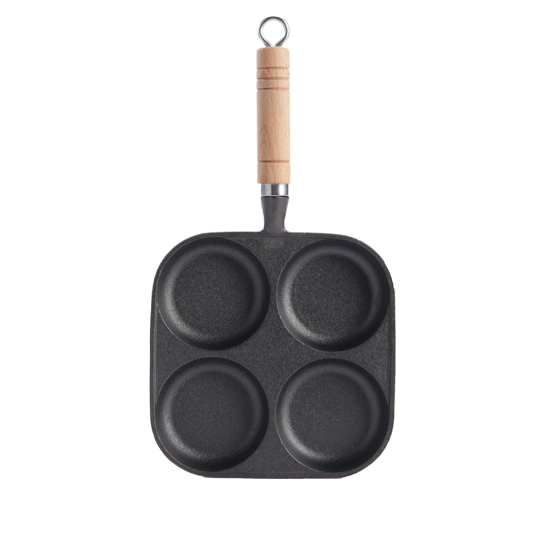 Cast iron 4-well breakfast pan by Vertex Kitchenware with four cooking wells and durable, non-stick surface.